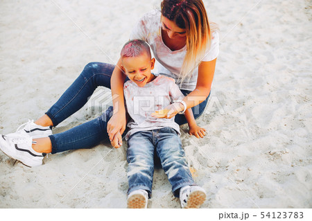 Mother with son playing in a summer park 54123783