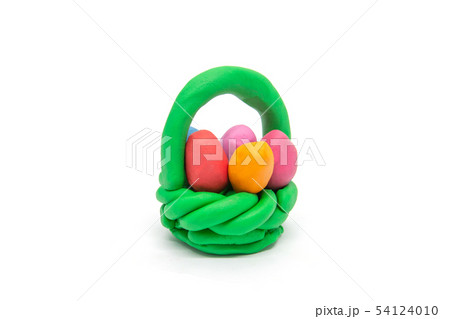 Play dough easter eggs in basket on white Play dough easter eggs in basket on white 54124010