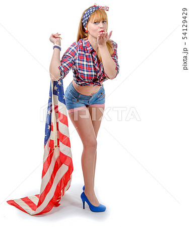 Sexy pin up girl  holding an American flag 54129429