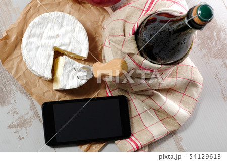 Camembert cheese traditional and bottle of cider 54129613