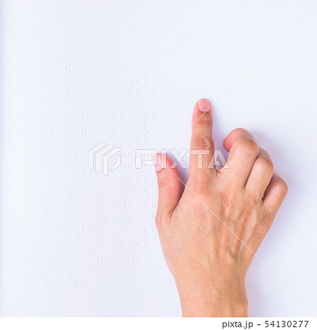 Finger touching paper texture reading Braille book 54130277