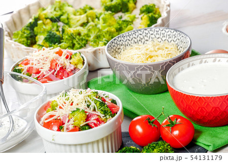 preparation of french quiche with tomatoes and preparation of french quiche with tomatoes and 54131179