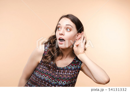 Charming girl listening to gossips. Studio 54131332