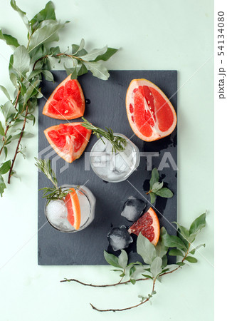 Refreshment grapefruit cocktail with rosemary on 54134080