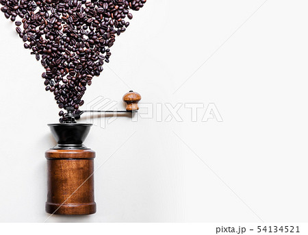 Roasted Coffee beans dropping into retro wooden 54134521