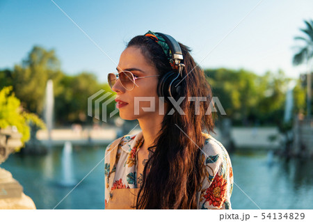 transgender model wearing sunglasses in the green park transgender model wearing sunglasses in the green park 54134829