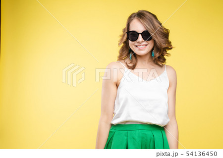Fashionable young woman in sunglasses. Studio 54136450