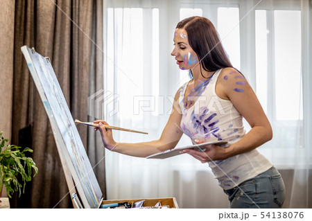 Young woman artist painting at home creative tools close-up Young woman artist painting at home creative tools close-up 54138076
