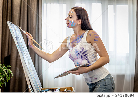 Young woman artist painting at home creative tools close-up Young woman artist painting at home creative tools close-up 54138094
