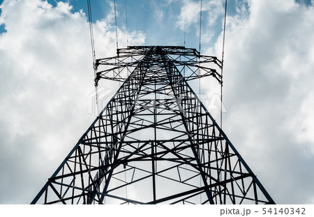 A high-voltage electricity pylon against blue sky A high-voltage electricity pylon against blue sky 54140342