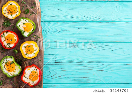 Yellow , red and green pepper with fried eggs Yellow , red and green pepper with fried eggs 54143705