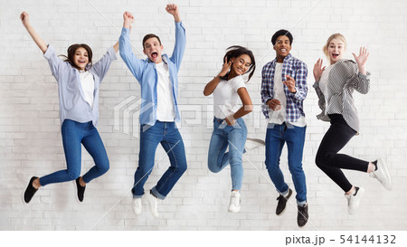 Happy students jumping on white background, passed exams Happy students jumping on white background, passed exams 54144132