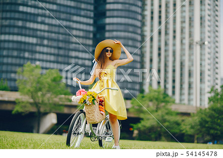 pretty girl with bicycle 54145478