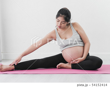 Asian pregnant woman doing yoga at home, lifestyle 54152414