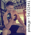 Handsome man doing the exercise with dumbbells, 54152441