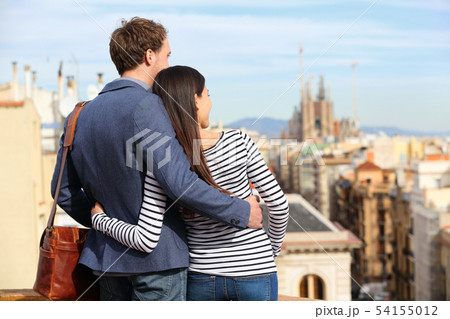 Romantic couple looking at view of Barcelona 54155012