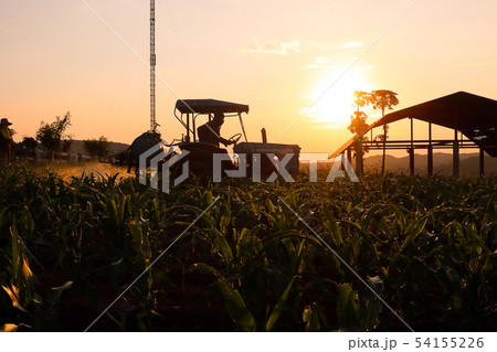 Farmer preparing and spraying pesticides on field. Farmer preparing and spraying pesticides on field. 54155226