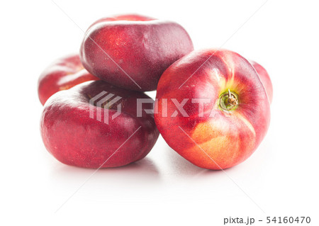 Ripe flat nectarines. 54160470