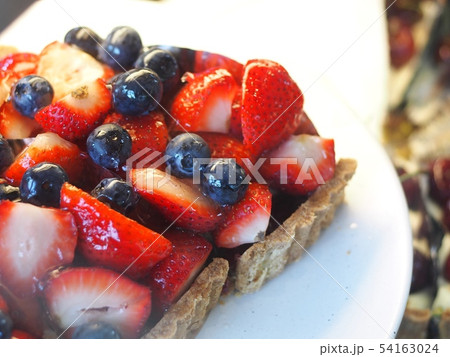soft butter cake with variety of delicious fruits 54163024