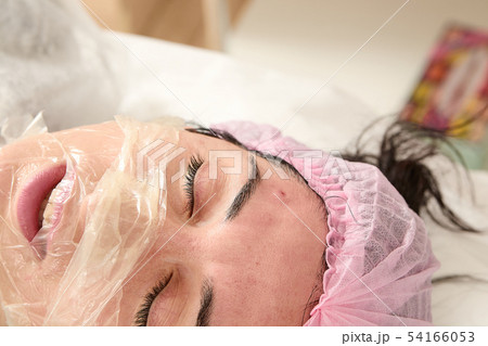 Young woman in beauty salon does manual face 54166053