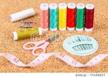 Sewing kit with colorful spools of threads and Sewing kit with colorful spools of threads and 54166827