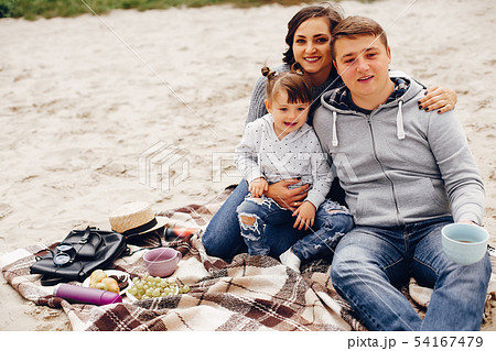 Fathet with daughter playing on a sand 54167479