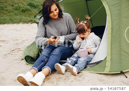 Mother with daughter playing in a summer park 54167587