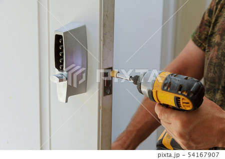 Man installing of the door lock security 54167907