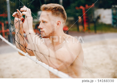 Handsome man training in a summer park Handsome man training in a summer park 54168330