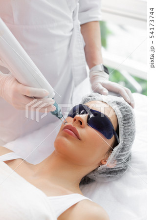 Beautiful pretty woman having a laser procedure 54173744