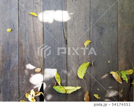Old slatted floors filled with leaves. Old slatted floors filled with leaves. 54174351