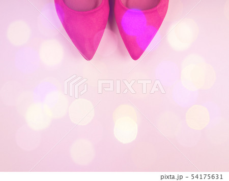 Pink background with woman's pumps and festive Pink background with woman's pumps and festive 54175631