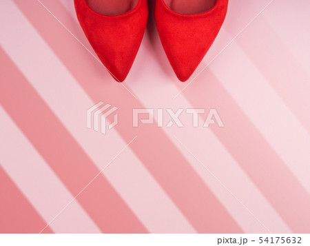 Monochrome background with red woman's shoes Monochrome background with red woman's shoes 54175632