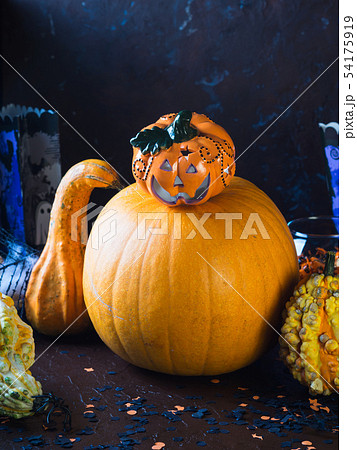 Halloween squash and candle. Decorations 54175919