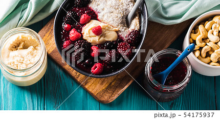 Healthy breakfast with berries and nut butter 54175937