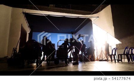 Behind the shooting production crew team and Behind the shooting production crew team and 54177674
