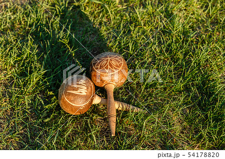 Cuban maracas lie on the green grass. Cuban maracas lie on the green grass. 54178820