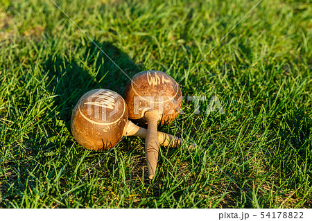 Cuban maracas lie on the green grass. Cuban maracas lie on the green grass. 54178822