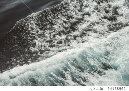 Aerial view to ocean waves. Blue water background Aerial view to ocean waves. Blue water background 54178962