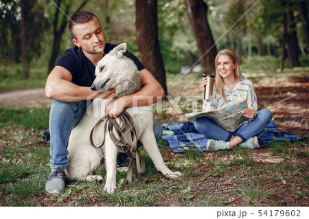 Beautiful couple spend time on a summer forest Beautiful couple spend time on a summer forest 54179602