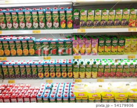 Fruit juices water in packs displayed for sale  54179936