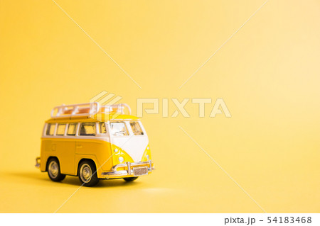 Funny yellow retro car with surfboard  Funny yellow retro car with surfboard  54183468