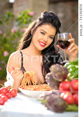 Vintage italian woman eating italian pasta with Vintage italian woman eating italian pasta with 54190856
