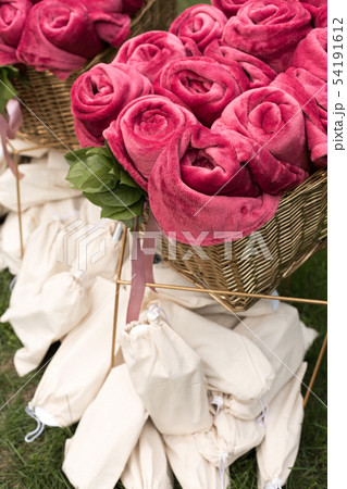 Warm pink blankets rolled up in the form of roses Warm pink blankets rolled up in the form of roses 54191612