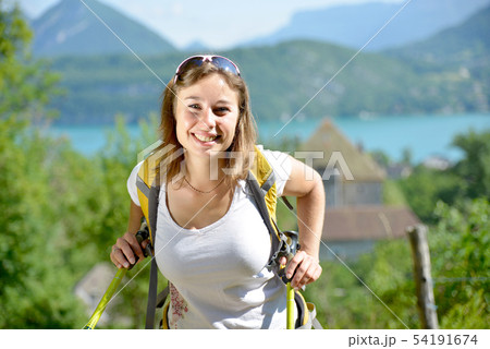 pretty young woman is hiking in mountains 54191674