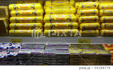 Dairy product displayed on cool chiller rack 54199779