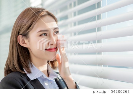 woman use oil blotting paper woman use oil blotting paper 54200262