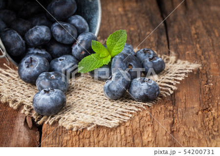 Blueberry on wooden table. Blueberry on wooden table. 54200731