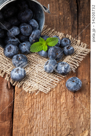 Blueberry on wooden table. Blueberry on wooden table. 54200732