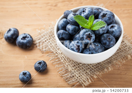 Blueberry on wooden table. Blueberry on wooden table. 54200733